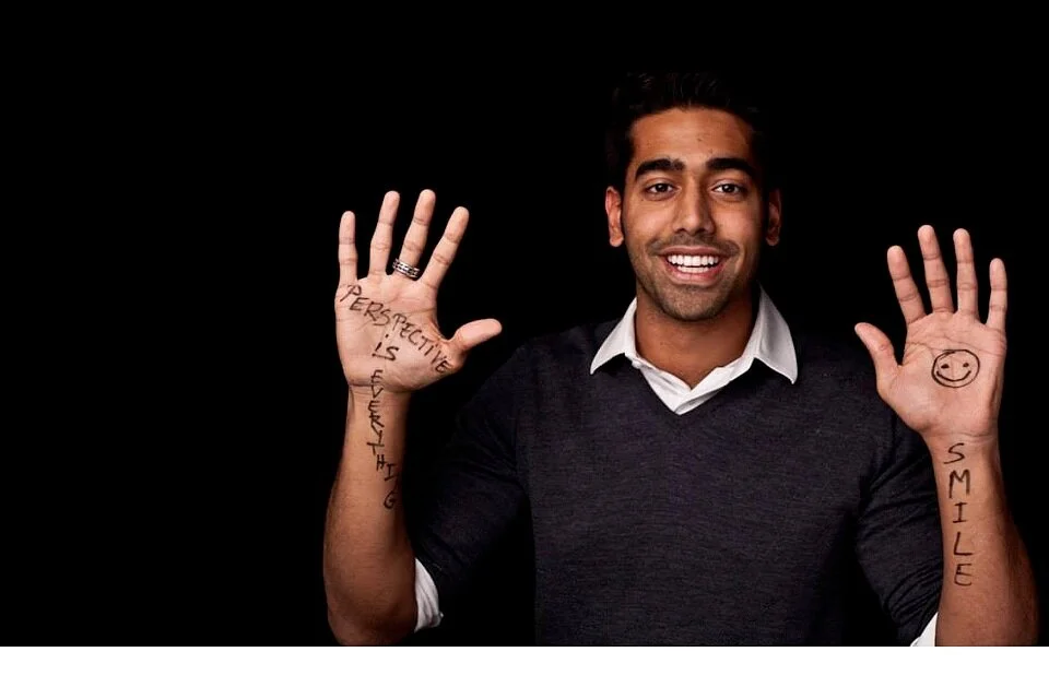 Fehzan Ali smiling with writing on his hands